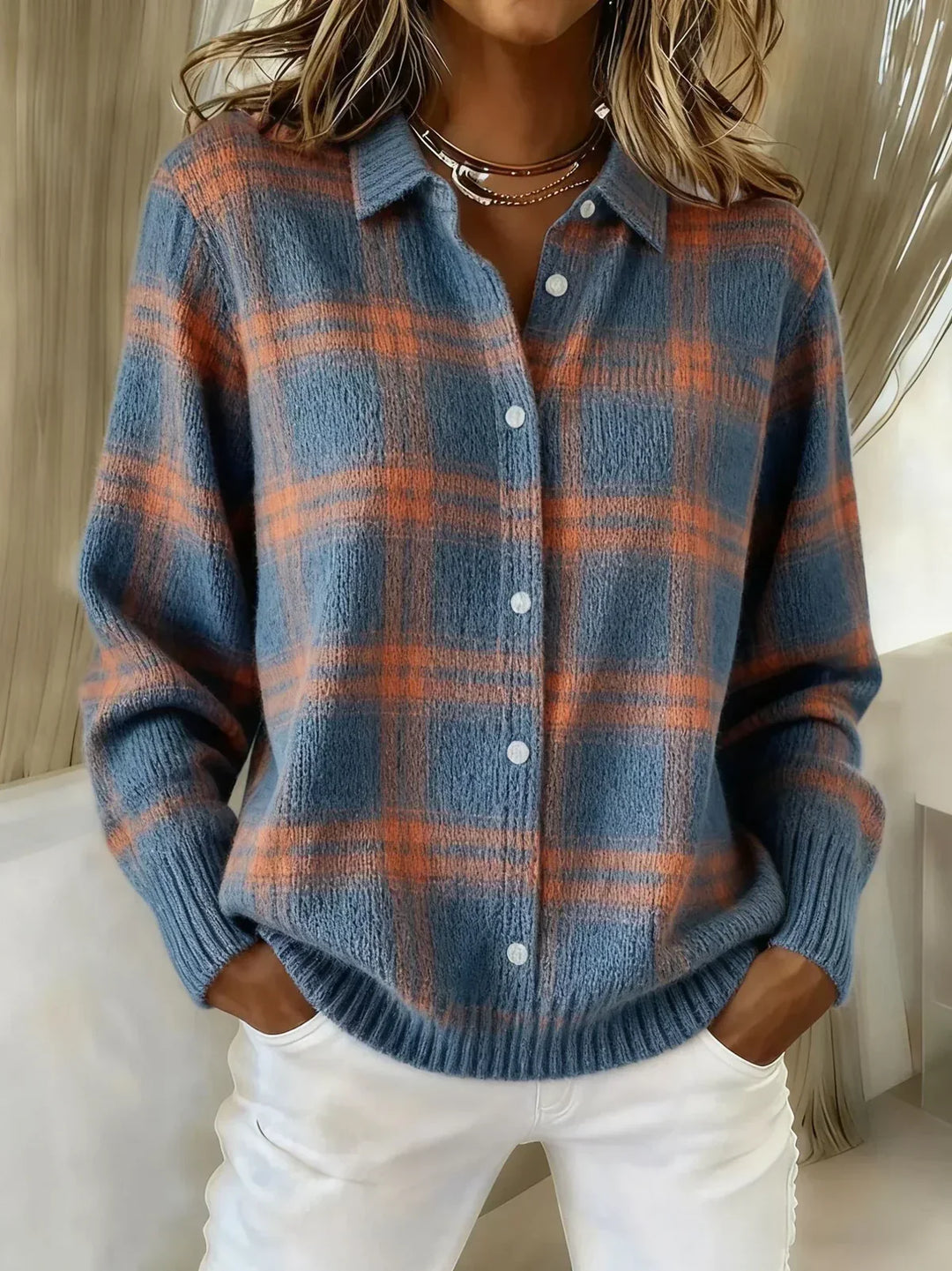Blue plaid knit cardigan with button front, collared V-neck, long sleeves, ribbed cuffs
