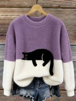 Two-tone cozy cat print sweater with purple and cream knit, black cat face front