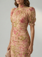 Floral high-neck maxi dress close-up: gathered neckline and puff sleeves