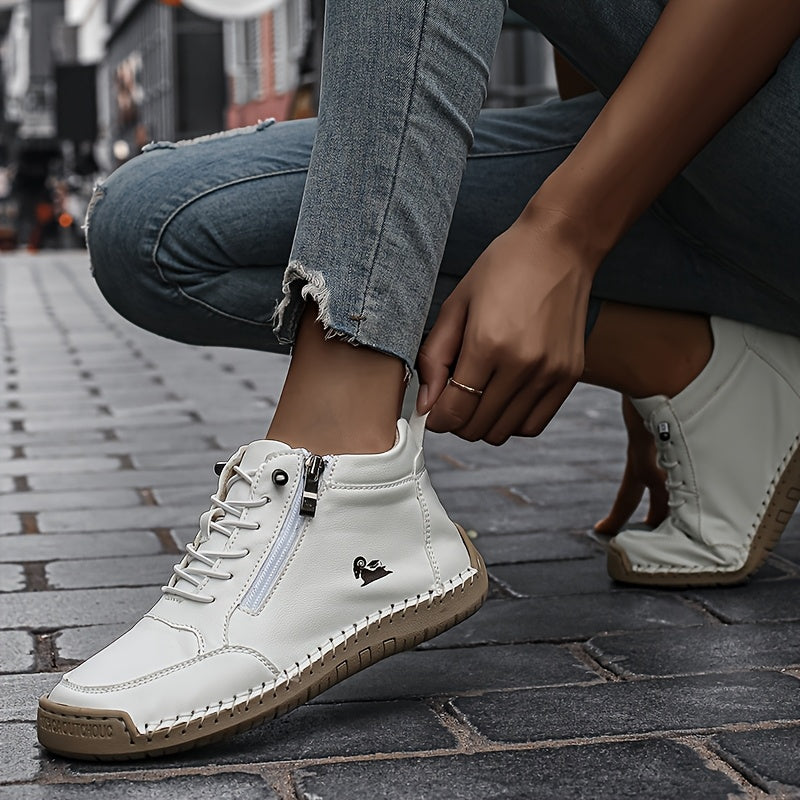 White ergonomic support sneaker worn with jeans; lace-up front and side zipper