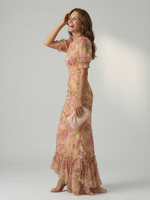 Floral high-neck maxi dress with puff sleeves, fitted waist, and ruffled hem
