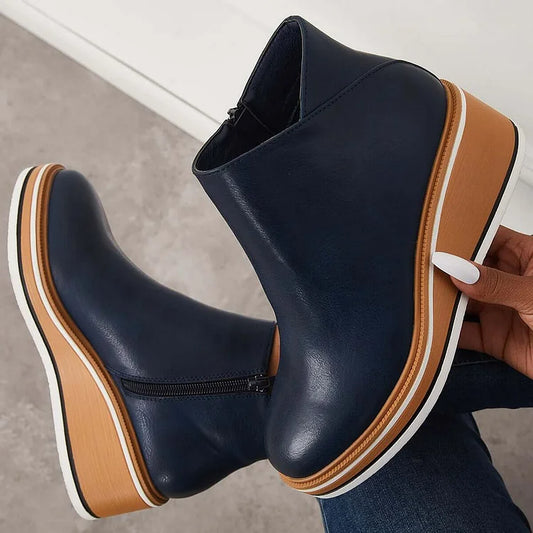 Blue orthopedic ankle boots with side zipper and tan-and-white platform sole