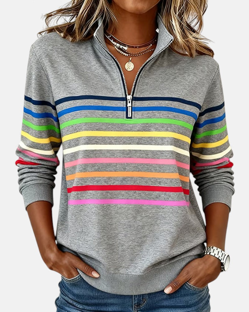 Gray quarter-zip sweatshirt with rainbow horizontal striped bands on chest and sleeves