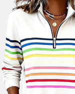White quarter-zip sweatshirt with rainbow striped bands across the chest and sleeves