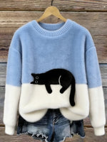 Light blue crewneck cat print sweater with white cuffs and hem
