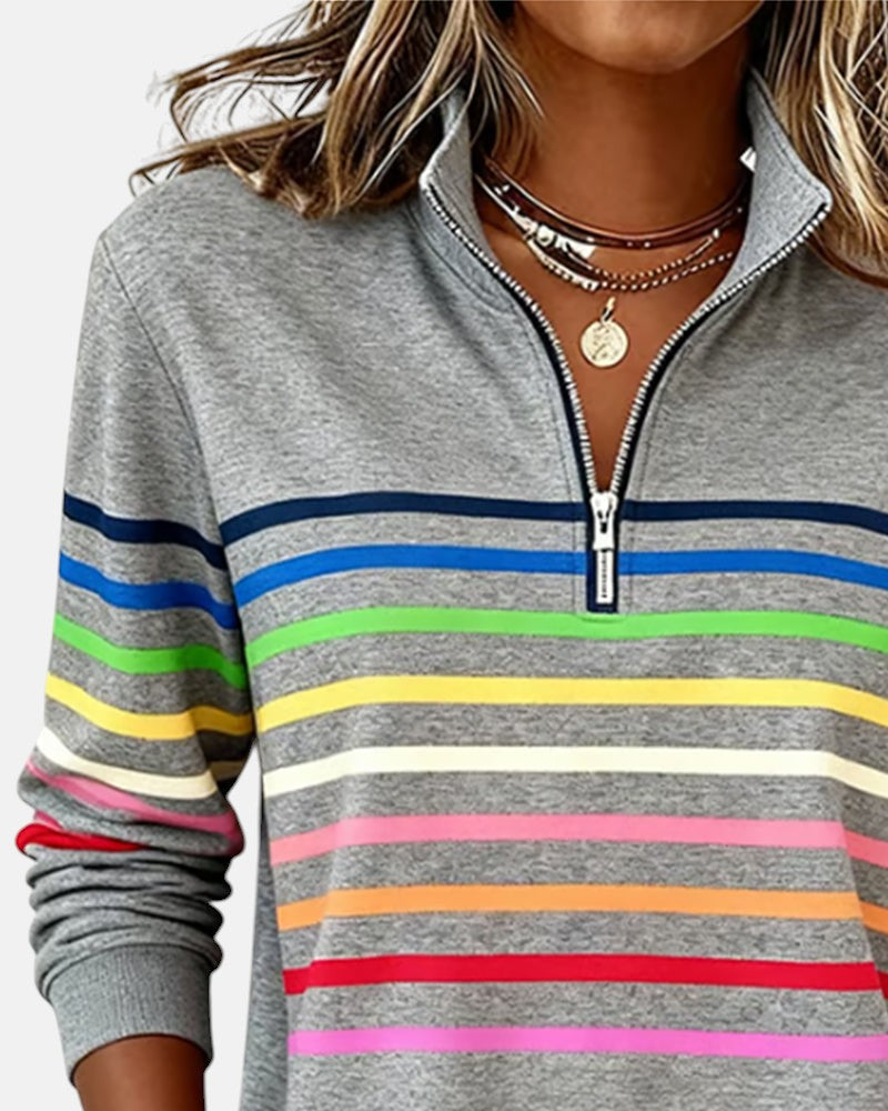 Gray quarter-zip sweatshirt with rainbow striped bands across the chest and sleeves