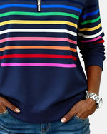 Navy quarter-zip sweatshirt with rainbow horizontal stripes and striped sleeve cuff