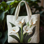 White quilted tote bag with floral lily applique and padded top handles