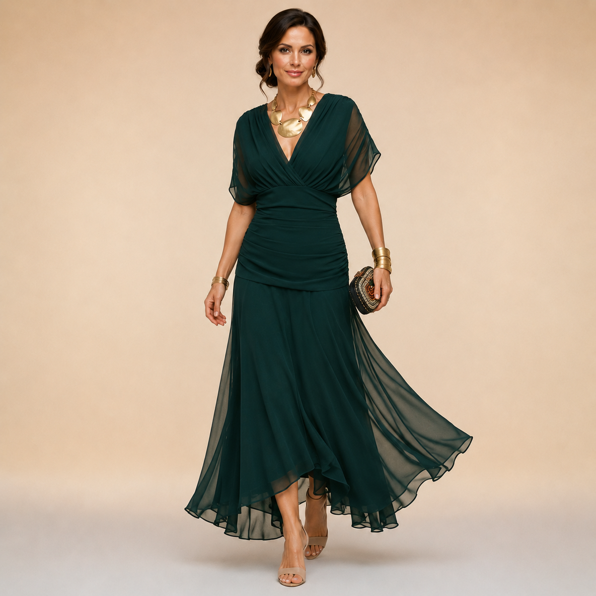 Dark green V-neck maxi dress with flutter sleeves and flowing chiffon hem