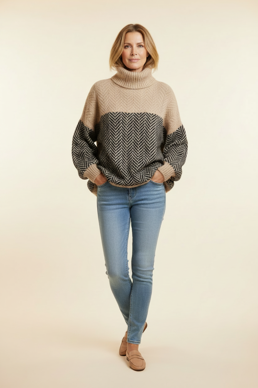 Beige and black chevron turtleneck pullover sweater, long sleeves, ribbed collar and cuffs.
