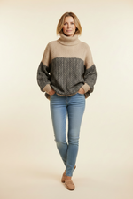 Beige and black chevron turtleneck pullover sweater, long sleeves, ribbed collar and cuffs.