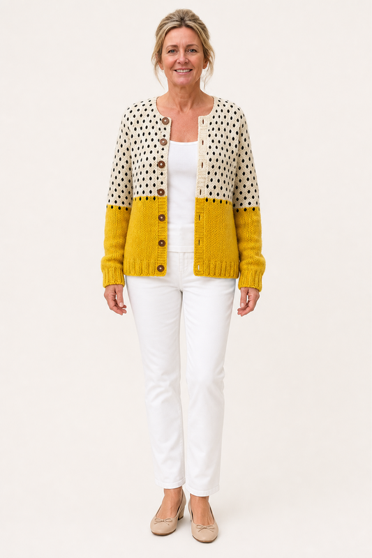 Yellow and cream polka-dot knit cardigan with button front, ribbed yellow cuffs and hem