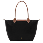 Black structured tote with tan trim, front flap pocket, gold snap
