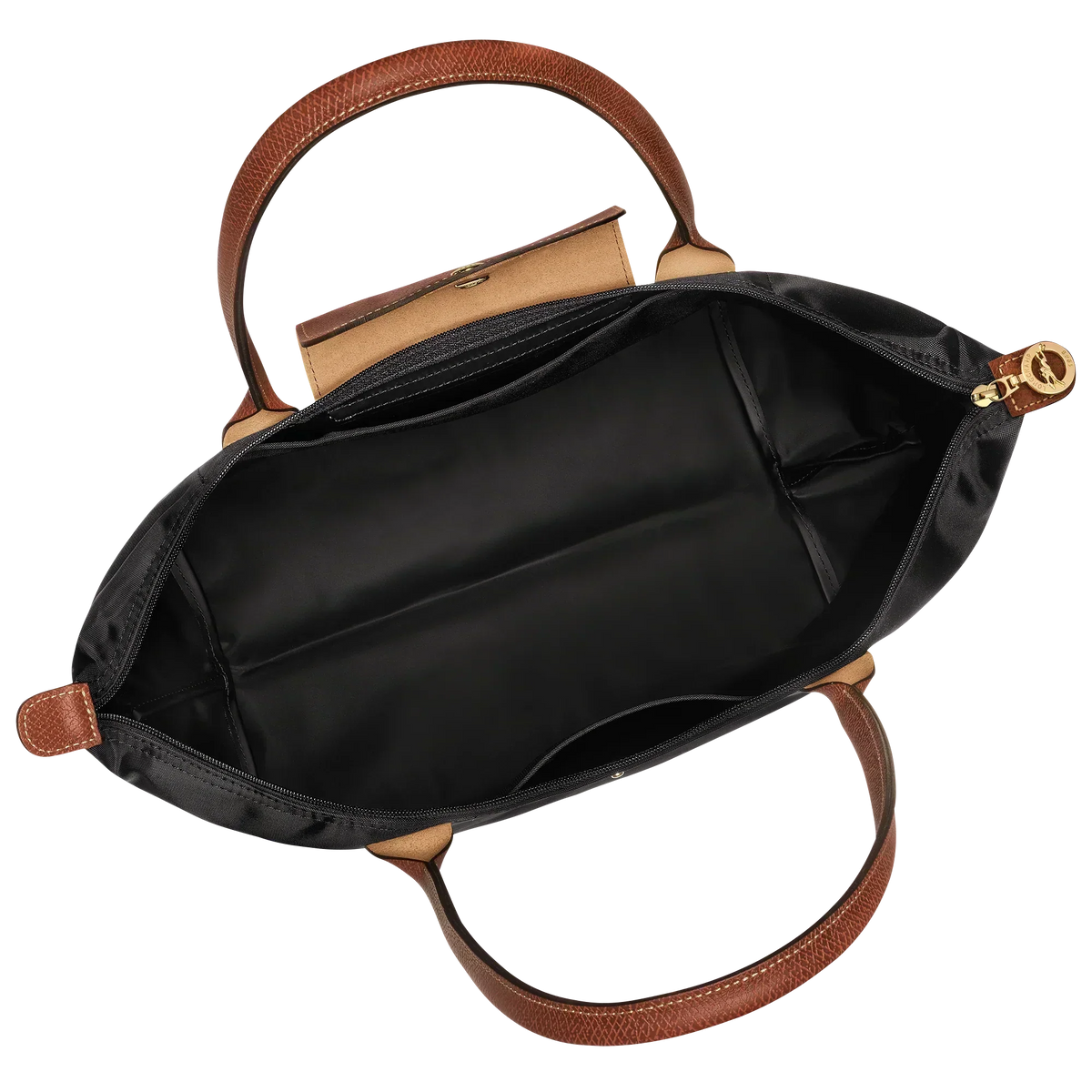 Black tote bag open inside shows tan lining, zipper top, gold pull, leather handles
