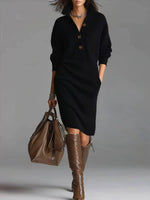 Black button-up sweater dress with long sleeves and three-button placket