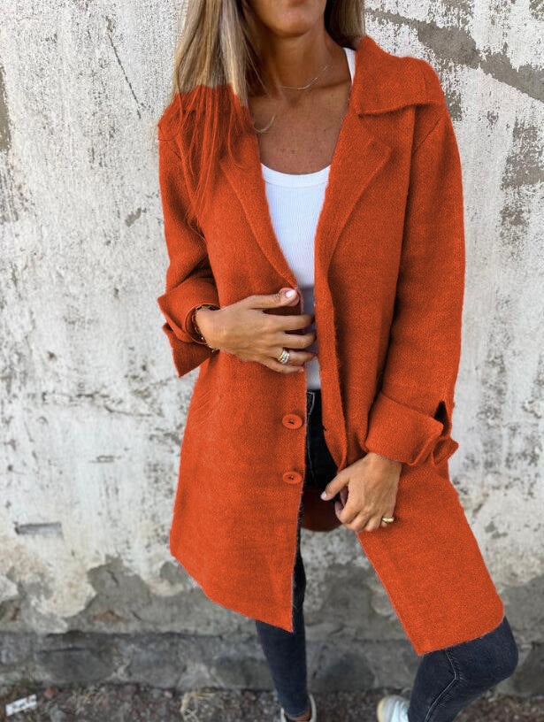 Rust orange long cardigan coat with lapels, button front, and patch pockets