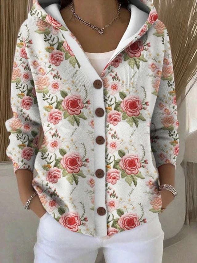 White hooded cardigan with pink rose print and brown button front