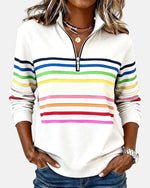 White quarter-zip sweatshirt with rainbow horizontal striped bands on chest and sleeves