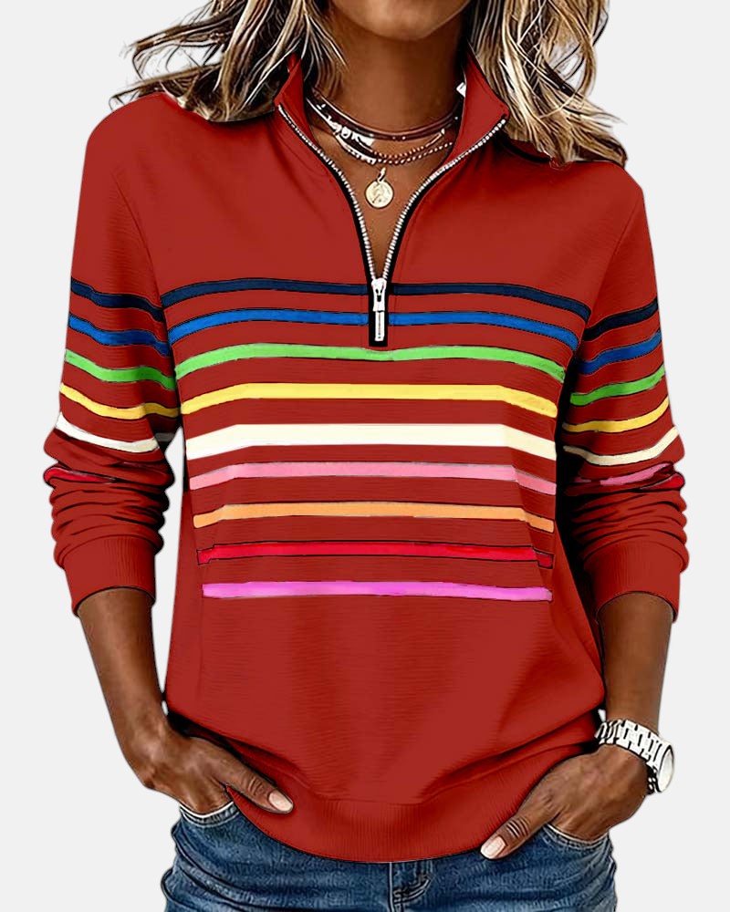 Red quarter-zip sweatshirt with rainbow horizontal striped bands on chest and sleeves