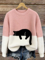 Pink cat print fuzzy sweater with white cuffs and hem