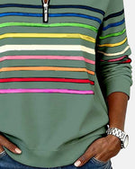 Green rainbow-striped quarter-zip sweatshirt with striped yoke and ribbed cuffs