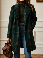 Green plaid wool coat with patch pockets, button front, and long sleeves