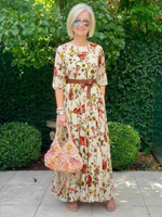 Floral belted maxi dress with round neck, three-quarter sleeves, and gathered tiered skirt