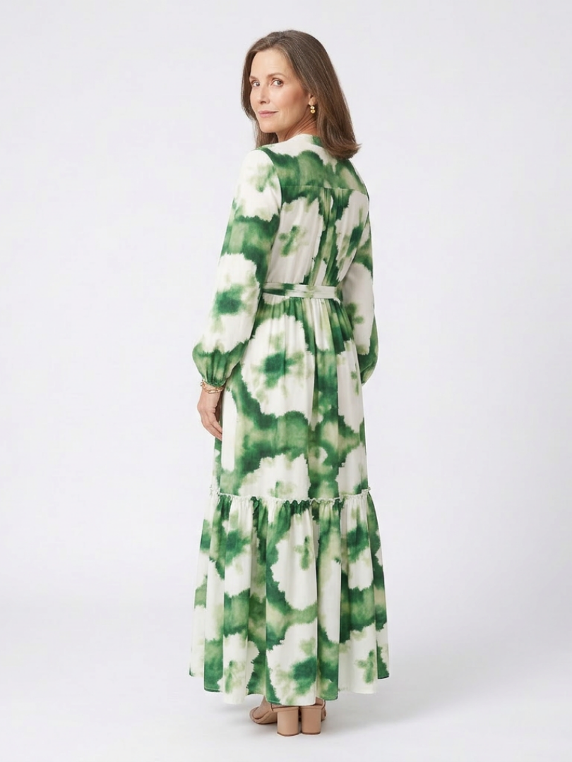 Green and white tiered maxi dress with long sleeves, tie waist, and V-neck