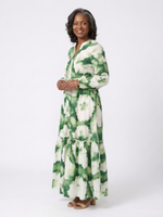 Green and white tie-waist tiered maxi dress with long sleeves and ruffled tiers