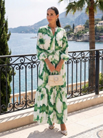 Green watercolor floral tiered maxi dress with long sleeves and tie waist