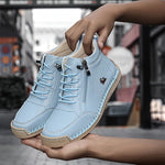 Light blue ergonomic support sneaker with lace-up front, side zipper, and rubber outsole