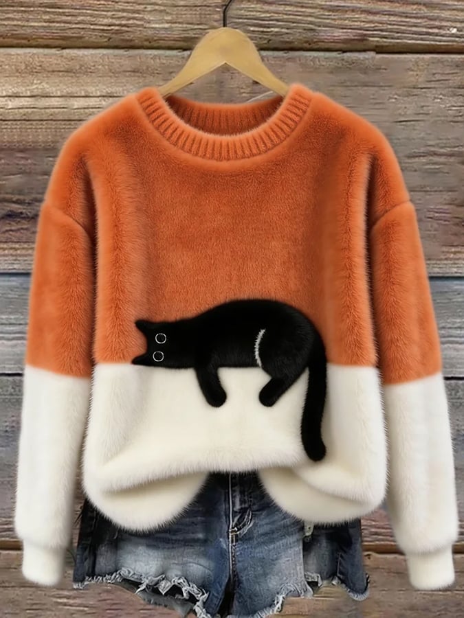 Orange cat print fuzzy sweater with white cuffs and hem