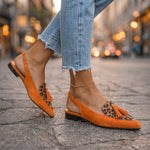 Orange suede fringe strap sandals with leopard print panel and small tassels