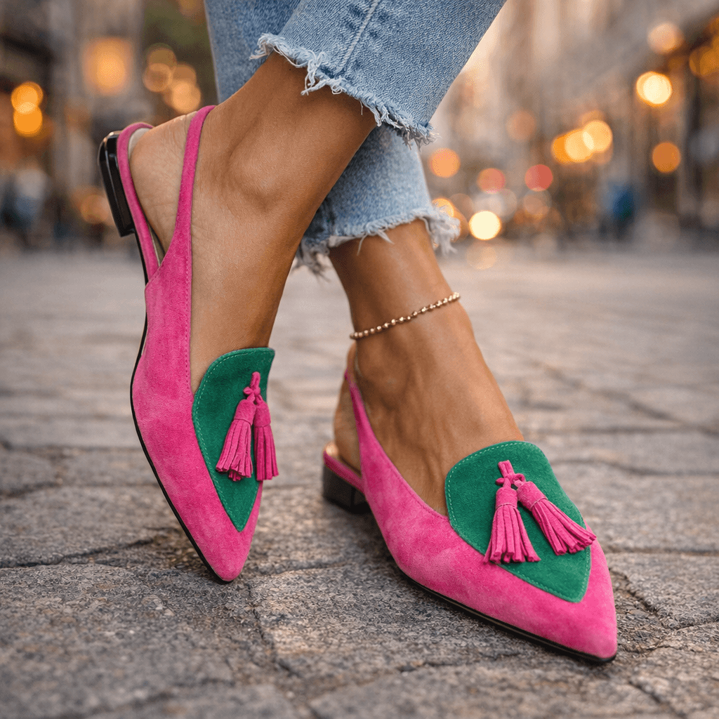 Pink suede fringe strap sandals with green heart-shaped insets and pink tassels