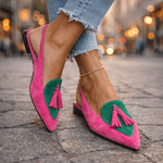 Pink suede fringe strap sandals with green heart-shaped insets and pink tassels