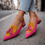 Pink suede fringe strap sandals with yellow insets and pink tassel accents