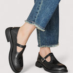 Black Mary Jane shoes with T-strap buckle and low block heel worn with jeans