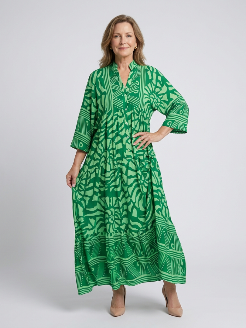 Green midi button-front dress with V-neck and 3/4 sleeves, tiered skirt, abstract leaf-like print.