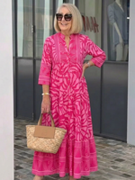 Pink midi button-front dress with V-neck and 3/4 sleeves, tiered skirt, patterned look.